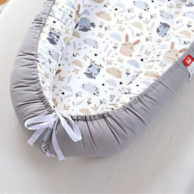 Réducteur de lit bébé - NidPortableBébé™- Portable